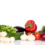 Pile of fresh vegetables over white background